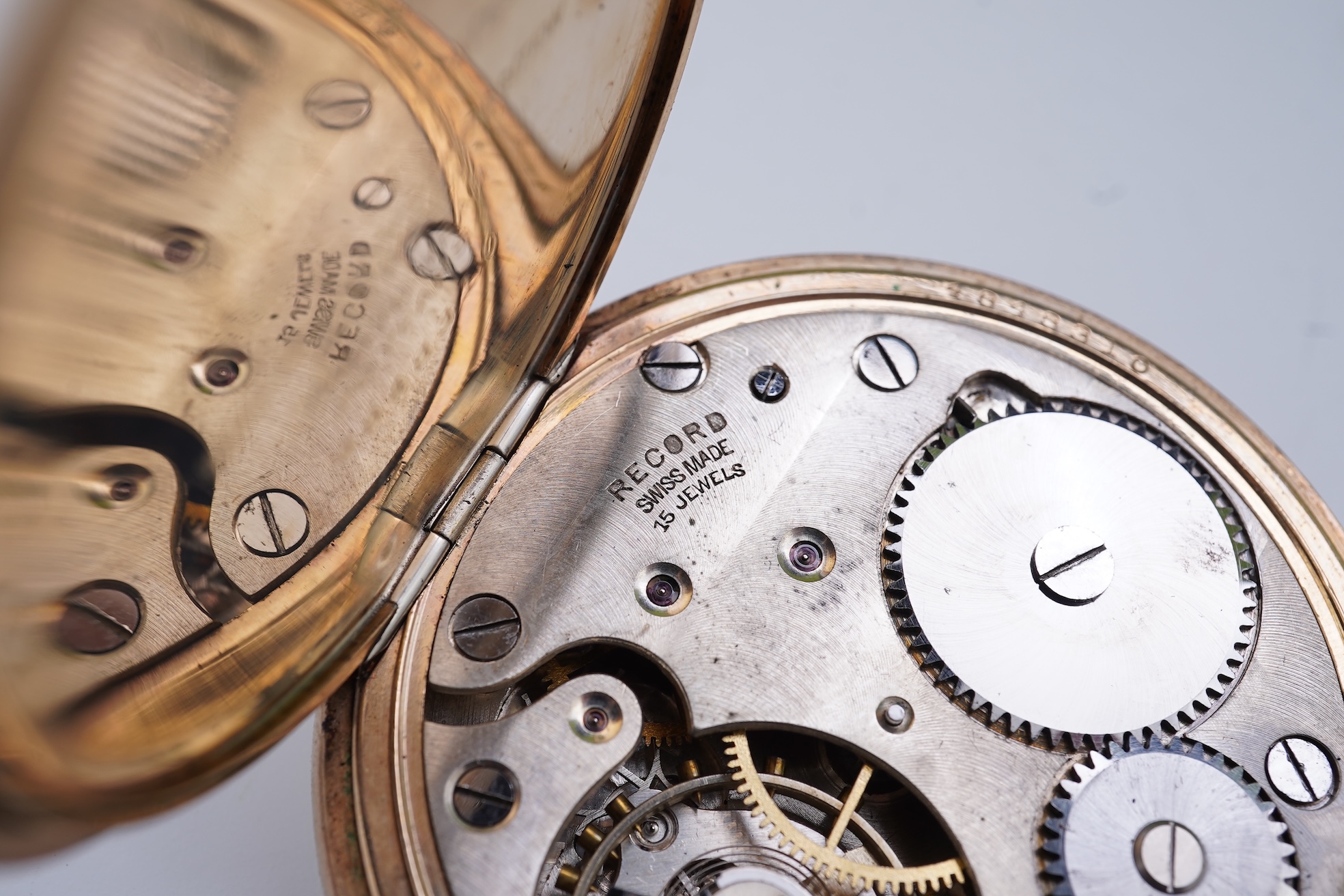 An amethyst fob seal, a gold Albert chain, and a pocket watch